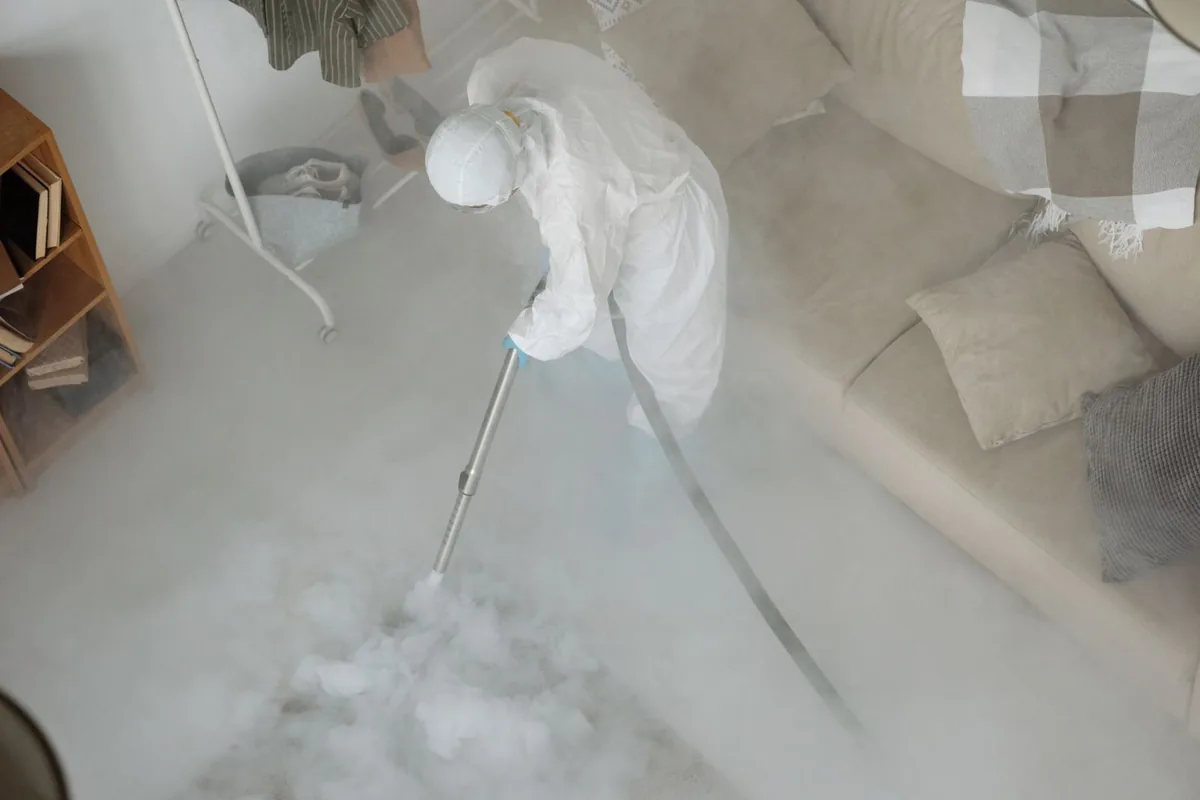 Biohazard cleanup technician in protective equipment, Milton, WV